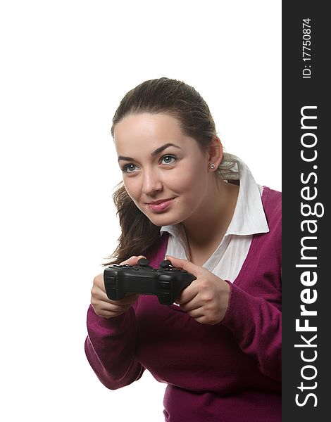 Young women play wideogame by gamepad on the white isolated background. Young women play wideogame by gamepad on the white isolated background