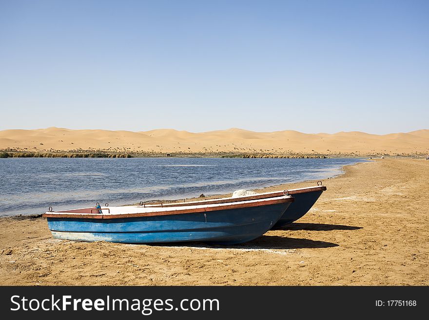 Boat and beach in the oasis. Boat and beach in the oasis