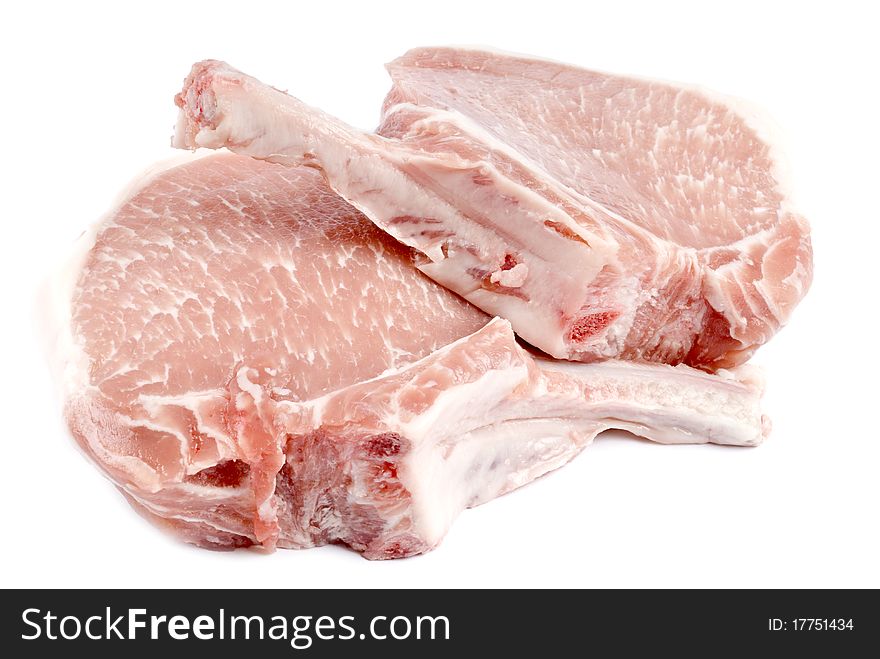 Two frenched pork chops on white background. Two frenched pork chops on white background