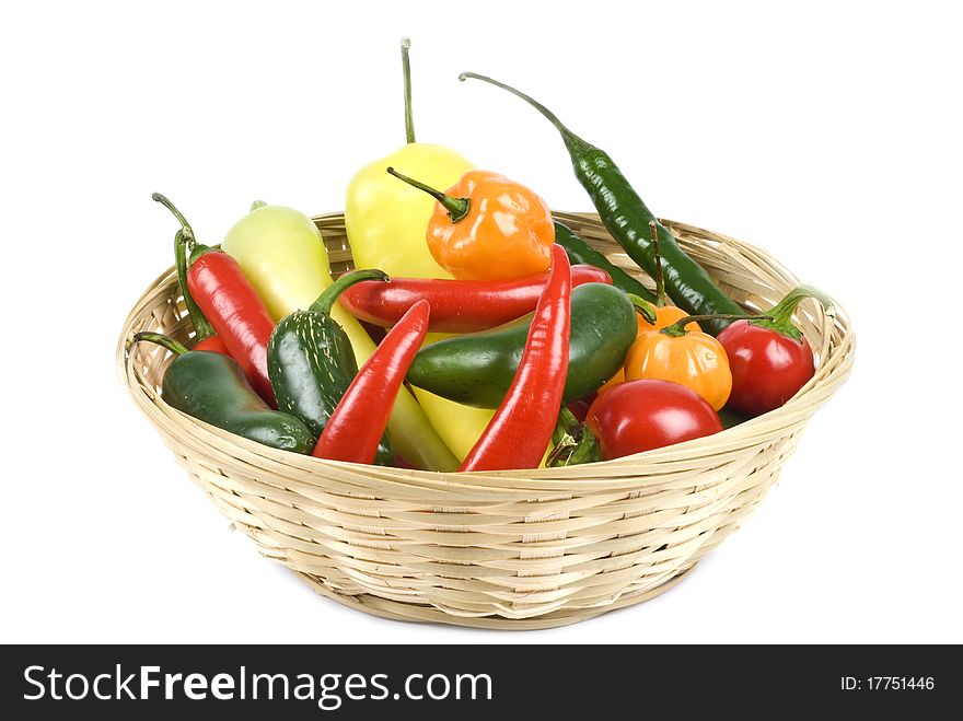 Basket Of Assorted Hot Peppers Isolated On White