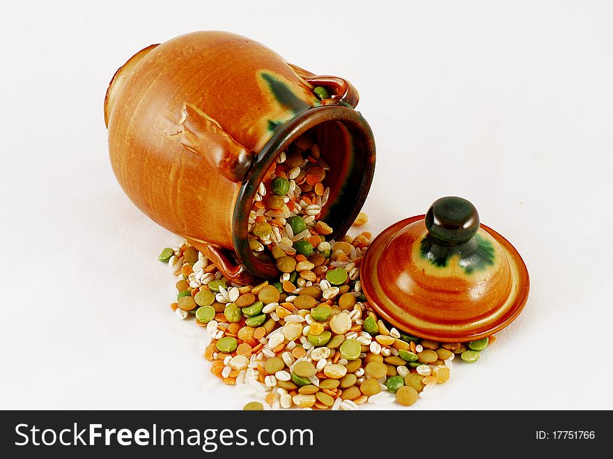 Ceramic jug with grain on white background. Ceramic jug with grain on white background