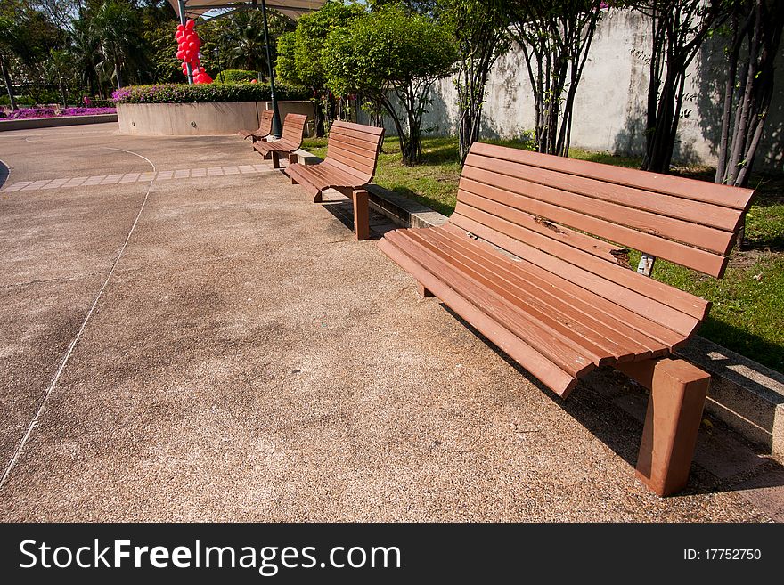 Wooden bench in the park on your holiday tree shade. Wooden bench in the park on your holiday tree shade.