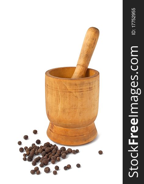 Wooden mortar with pestle and peppercorns isolated on white