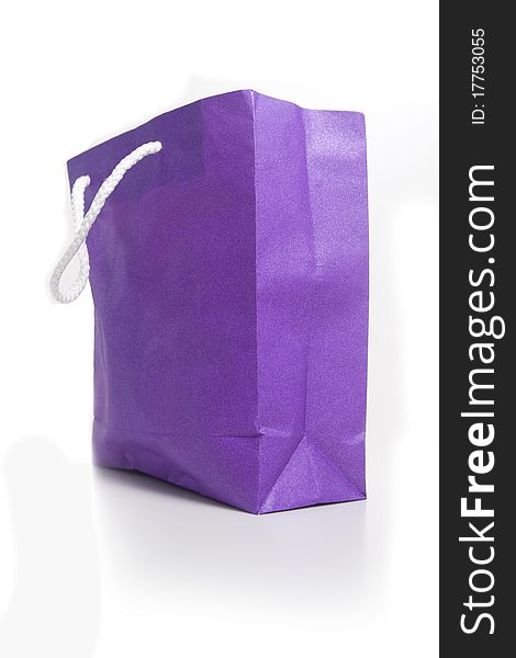 Three colorful paper shopping bags, isolated on white. Three colorful paper shopping bags, isolated on white.