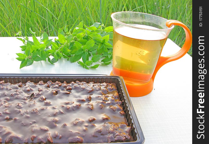 Herbal tea and chocolate cake tea-drinking outdoors