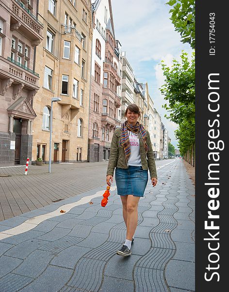 Young girl walking down the street