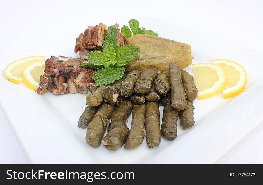 Middle Eastern dish consisting of stuffed vine leaves and zucchini. Middle Eastern dish consisting of stuffed vine leaves and zucchini