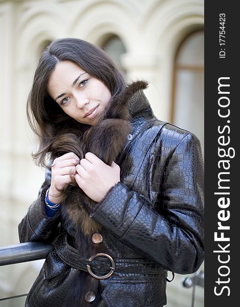 Young girl hiding a fur collar she bowed her head