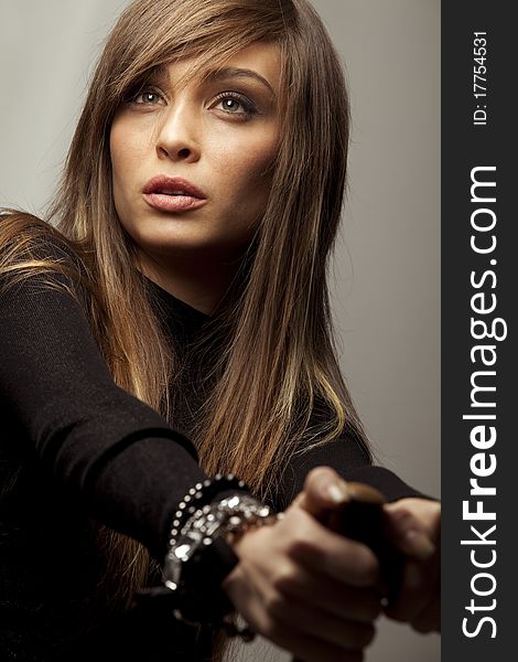 Young lady with accessories portrait in dark tones