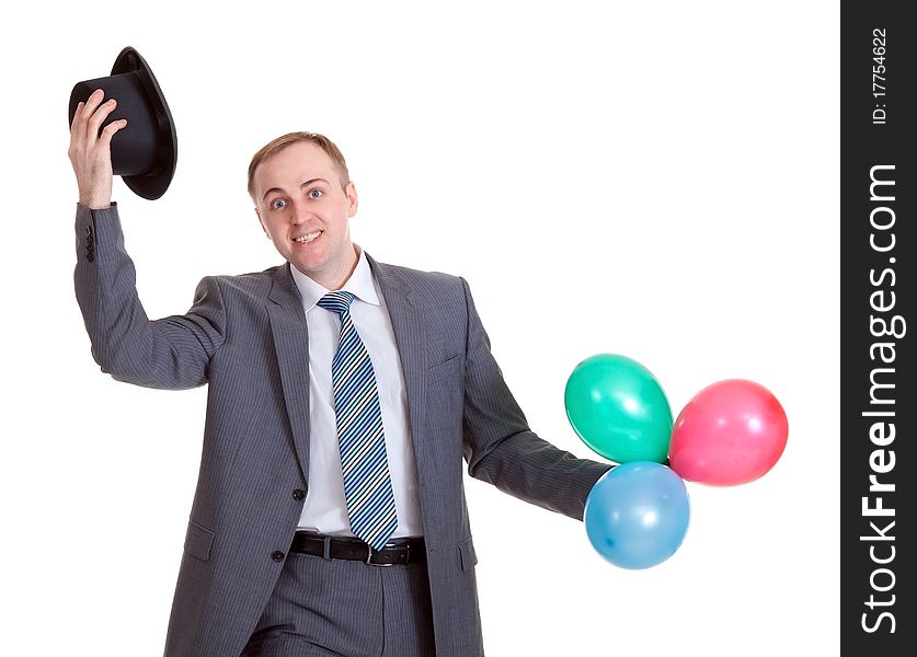 Businessman in a black hat with inflatable colored balls
