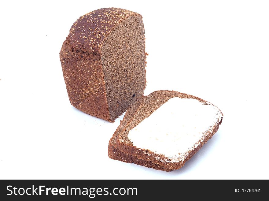 Sliced bread with many seeds and butter isolated on white background. Sliced bread with many seeds and butter isolated on white background.