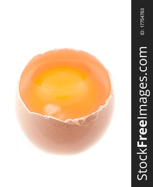Chicken open egg and yolk isolated on white background.