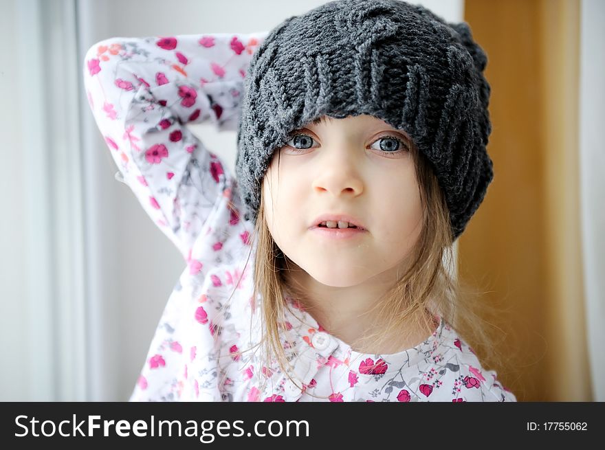 Adorable Little Girl In Grey Knit Hat