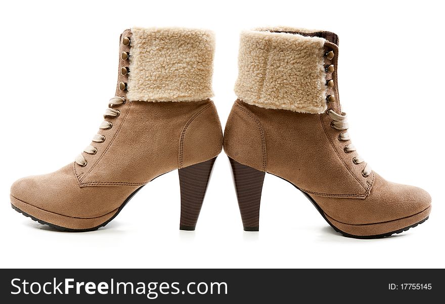 Pair of beige women's shoes with fur on the heel. Pair of beige women's shoes with fur on the heel