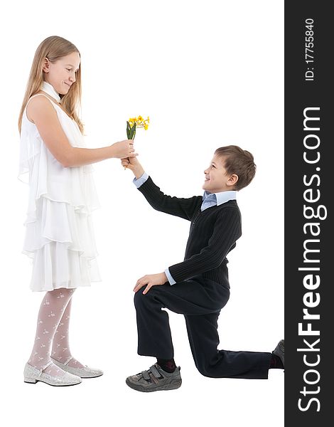 The boy gives to the girl flowers
 on a white background