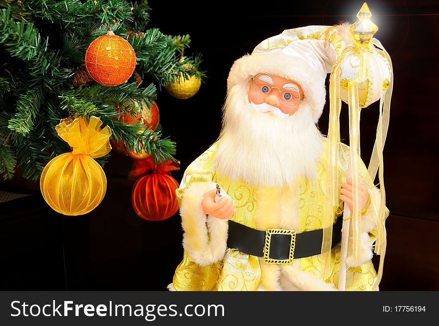 Golden Santa Claus with candy