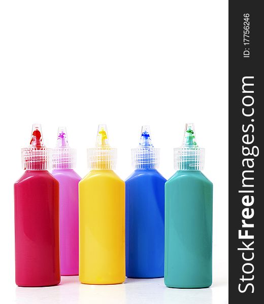 Bottles with colors isolated on white background