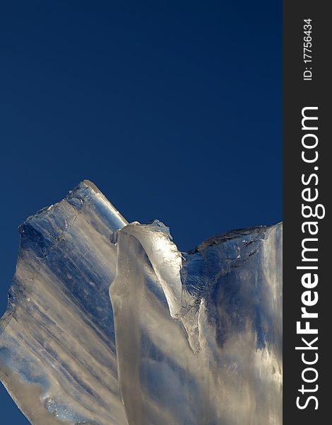 Blocks of ice against the sky shined with a sunlight. Blocks of ice against the sky shined with a sunlight