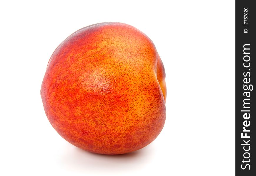 Ripe peach on a white background