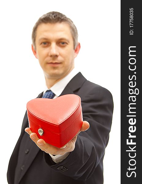 Happy valentine - young man holding a red heart gift box. Happy valentine - young man holding a red heart gift box