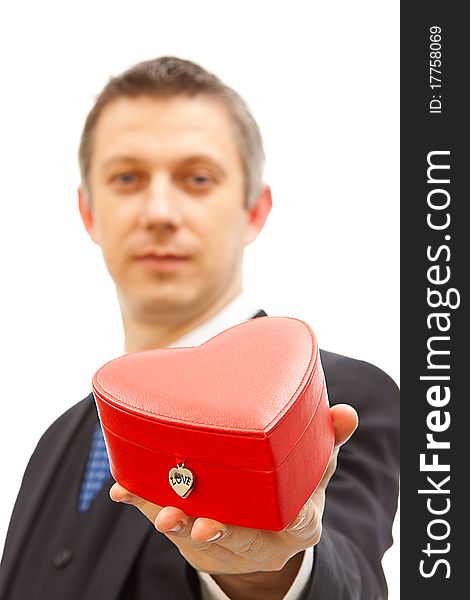 Valentine present in a red gift box holding by a man. Valentine present in a red gift box holding by a man