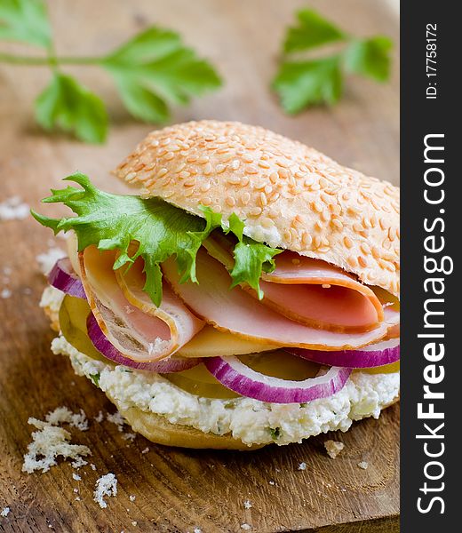 Rustic Sandwich with Lettuce, Cucumber, Ham and Red Onions