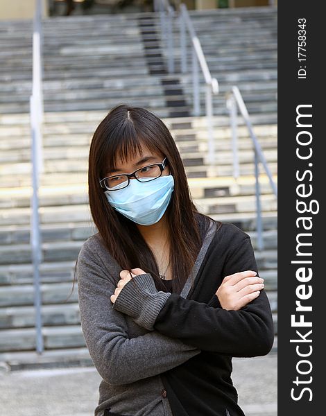 Asian Girl Who Is Sick And Wearing Mask