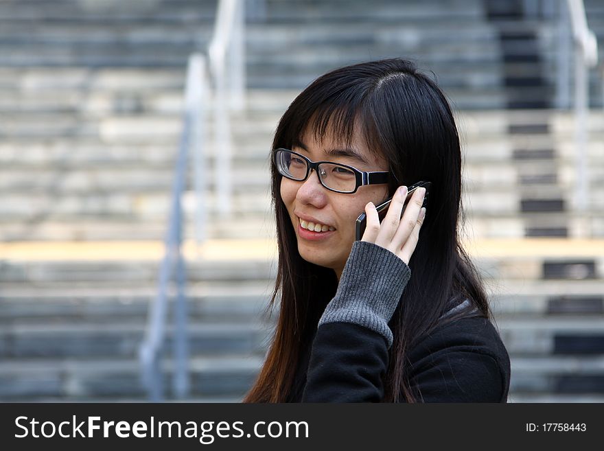 Chinese girl who is talking in phone