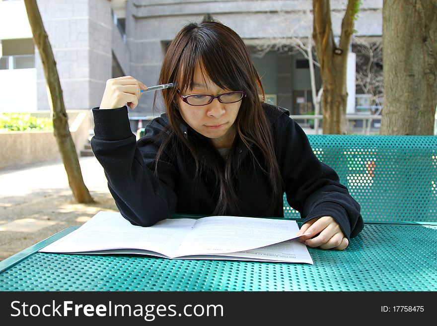 Chinese Girl Who Is Reading Books