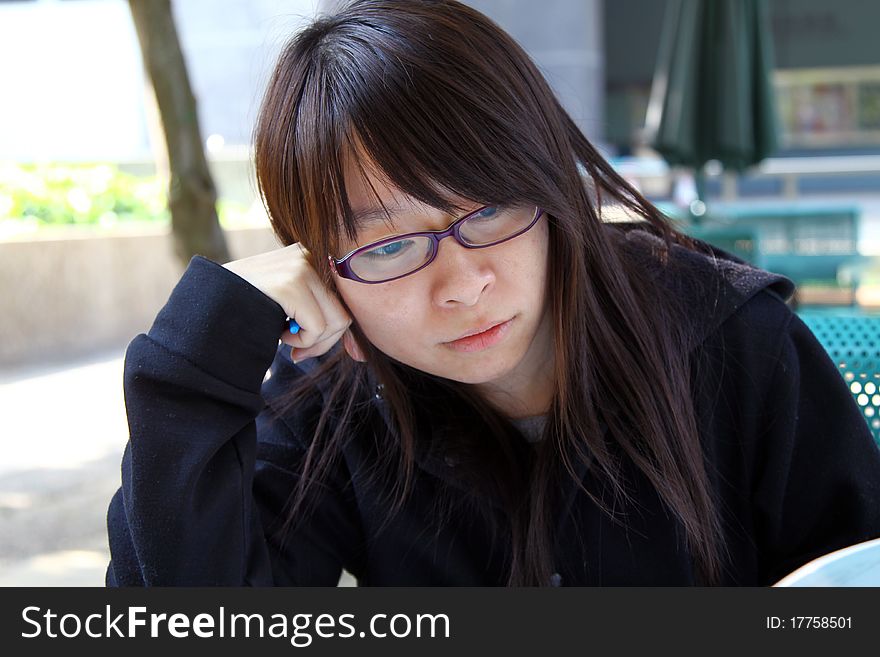 Chinese girl who is reading books