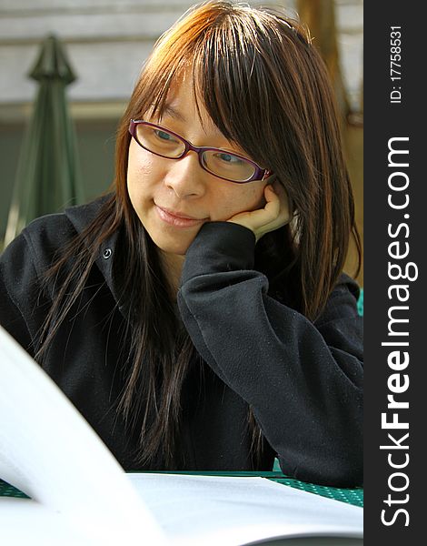 Chinese girl who is reading books