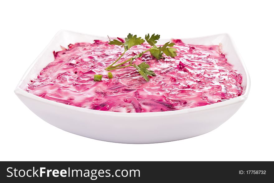 Herring mayonnaise. Delicious, fresh salad on a plate isolated on white background