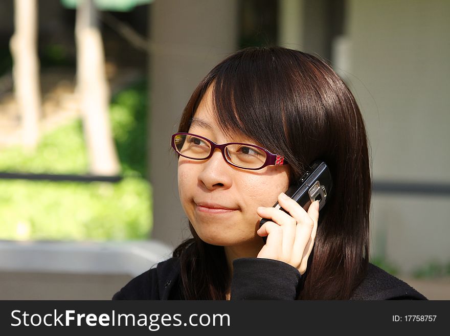Chinese girl who is talking in phone