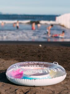 Close-up Of A Swim Ring On The Beach. Summer Holidays Concept Stock Photo