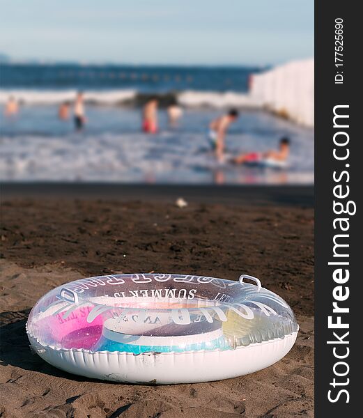 Close-up Of A Swim Ring On The Beach. Summer Holidays Concept