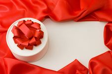 Box With A Gift On A Red Fabric Stock Photos Box With A Gift On A Red Fabric Stock Photos