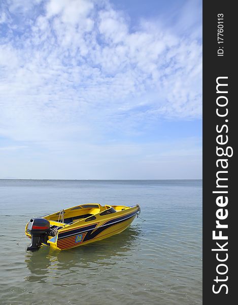 The yellow boat in the sea, Thailand