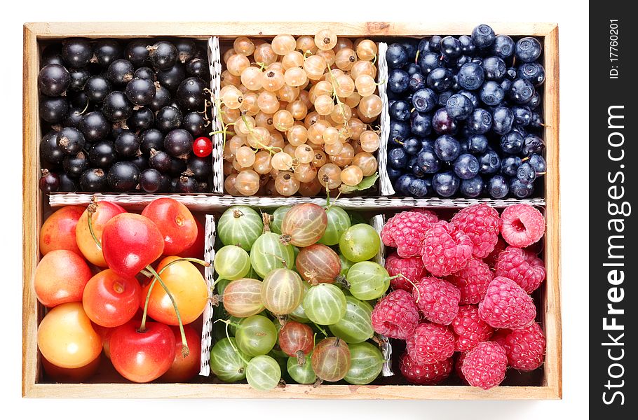 Different colourful berries in the box. Different colourful berries in the box.