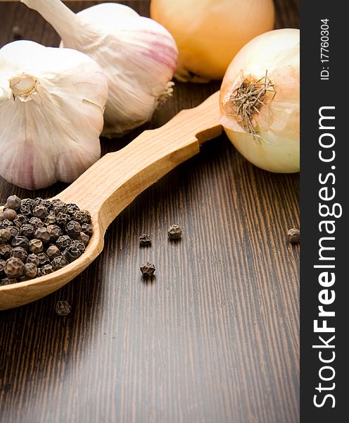 Garlic, Onion And Black Pepper On Spoon