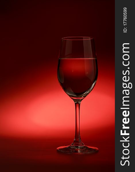 Glass of white wine on a dark background