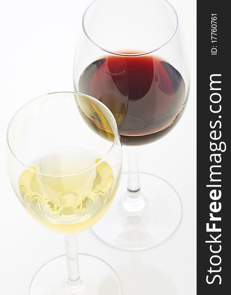 A glass of white wine and red wine isolated on white background
