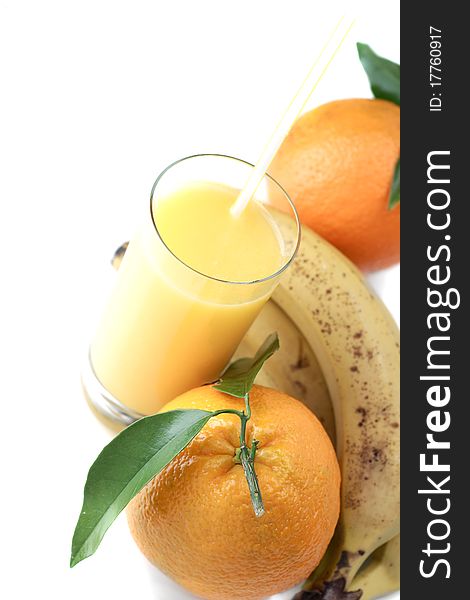 Orange and orange juice in a glass on a white background