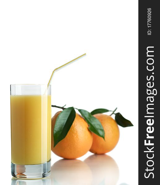 Orange and orange juice in a glass on a white background