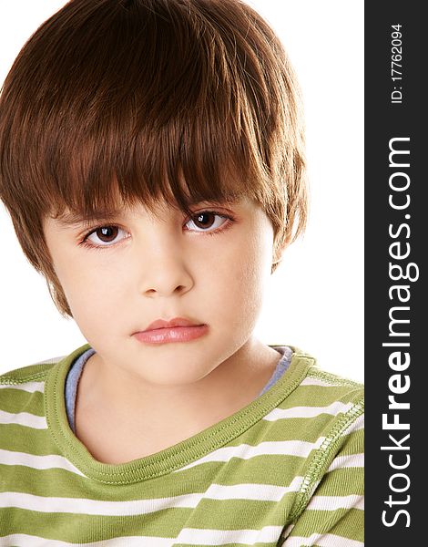 Portrait of beautiful little boy with serious look