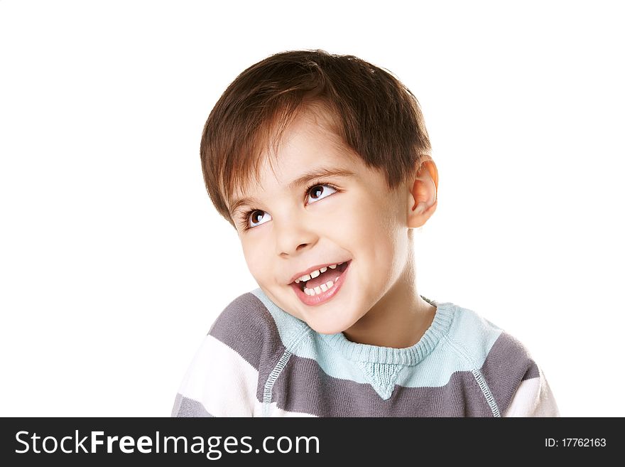 Portrait of happy little joyful laughing boy looking up on white background. Portrait of happy little joyful laughing boy looking up on white background