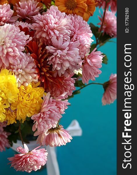 A bouquet of chrysanthemums on a blue background. A bouquet of chrysanthemums on a blue background
