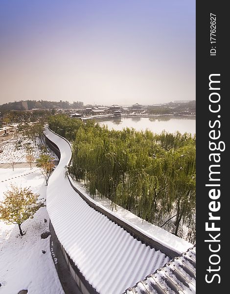 The photo was taken in Qujiang Pool Relic Park( Xi'an city, China) early in the morning while it snowed the last night. The sights is all white and peacful. It reminds us pureful. The photo was taken in Qujiang Pool Relic Park( Xi'an city, China) early in the morning while it snowed the last night. The sights is all white and peacful. It reminds us pureful.