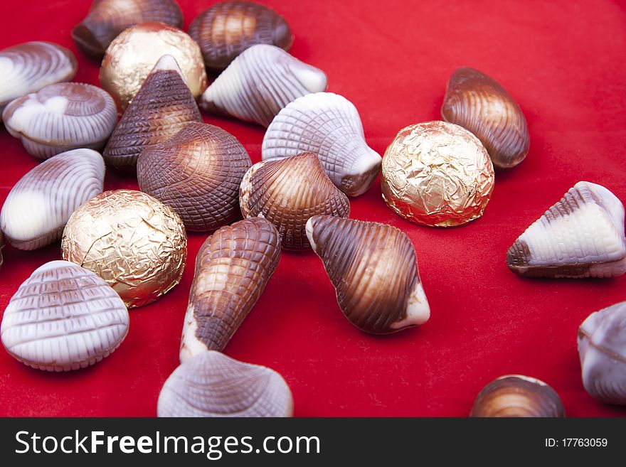 Chocolate sweets in shape of little shells. Chocolate sweets in shape of little shells