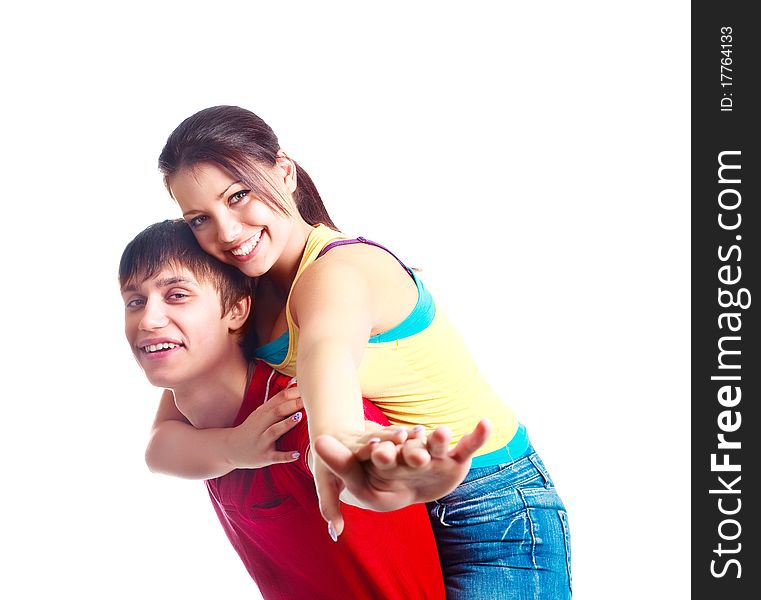 Happy excited teenage couple, a boy giving a piggyback ride to his girlfriend (focus on the girl)