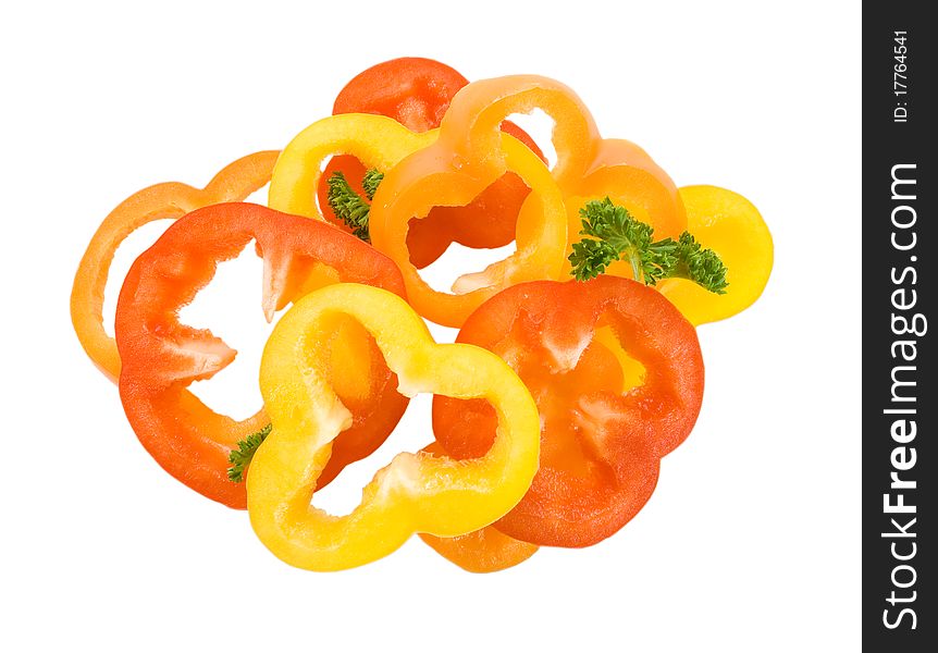 Pepper rings in yellow red orange colors on thw white background